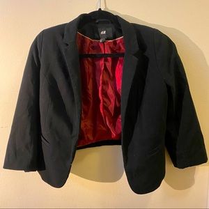 Cropped blazer, silk like red lining.